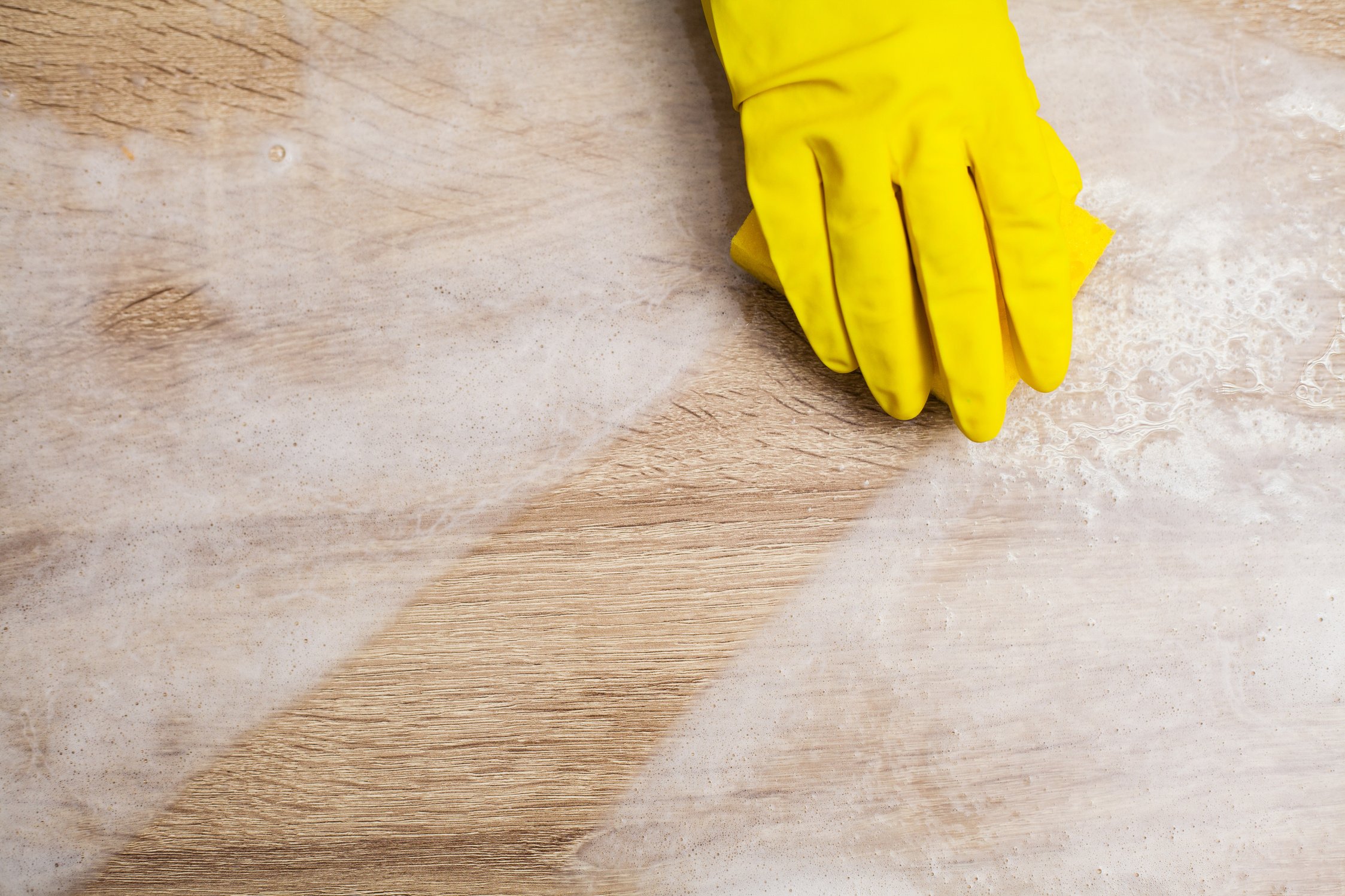 Closeup of Cleaning Company Worker Cleans Office.